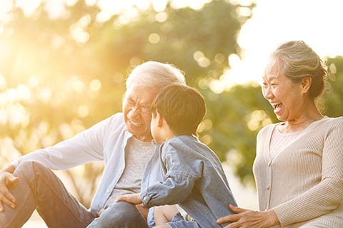 Asian grandparents with their grandson