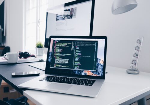 laptop with html code on screen