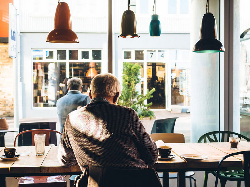 older man at a coffee shop