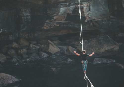 a person balancing on a rope