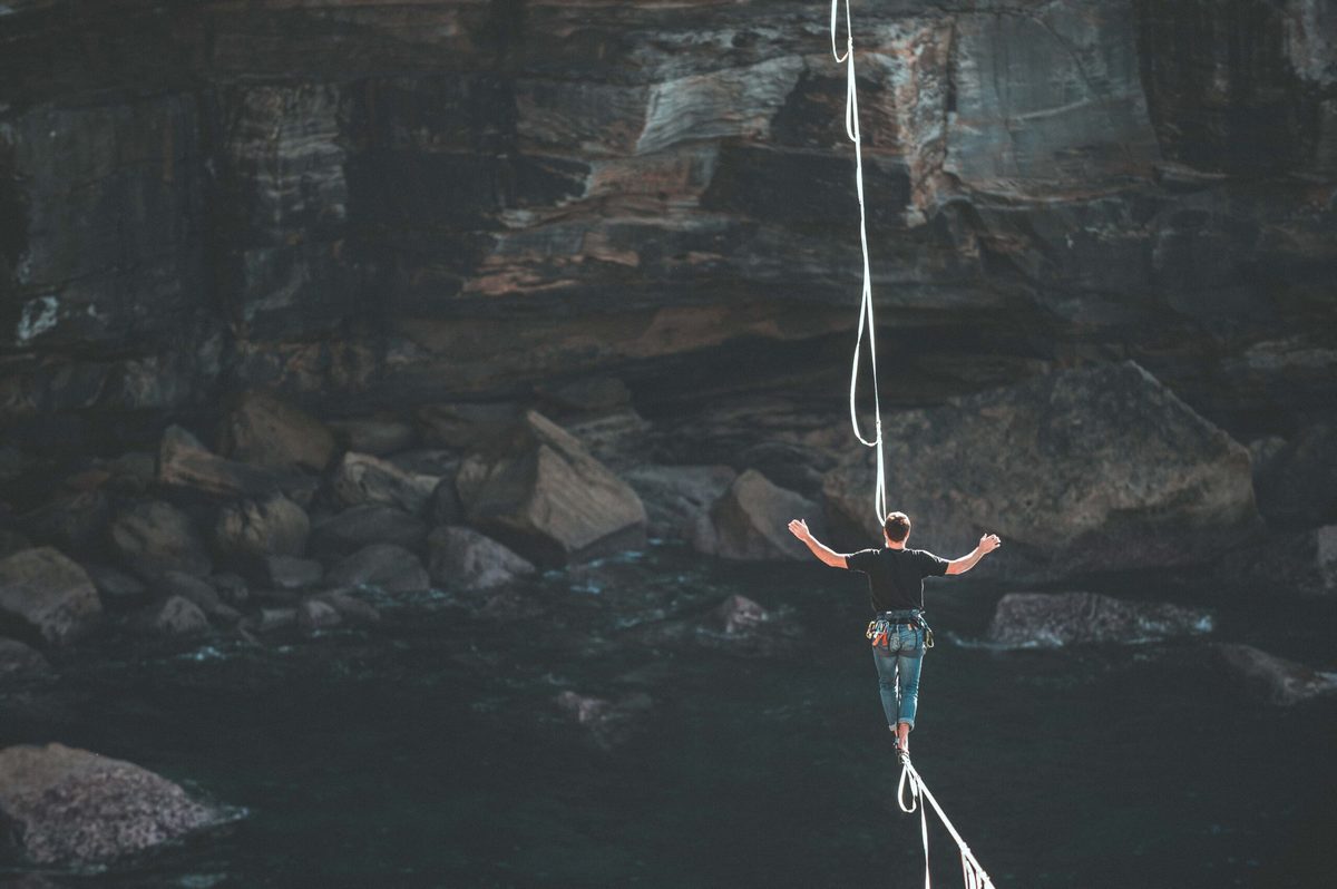 a person balancing on a rope