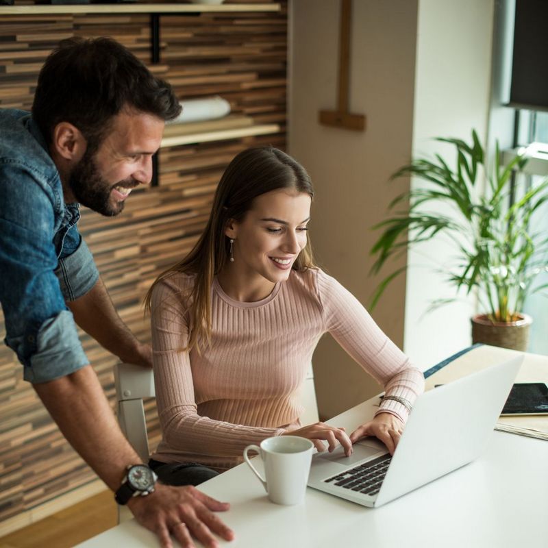 small business owner at laptop desk