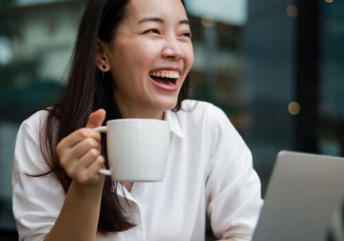 asian woman drinking coffee